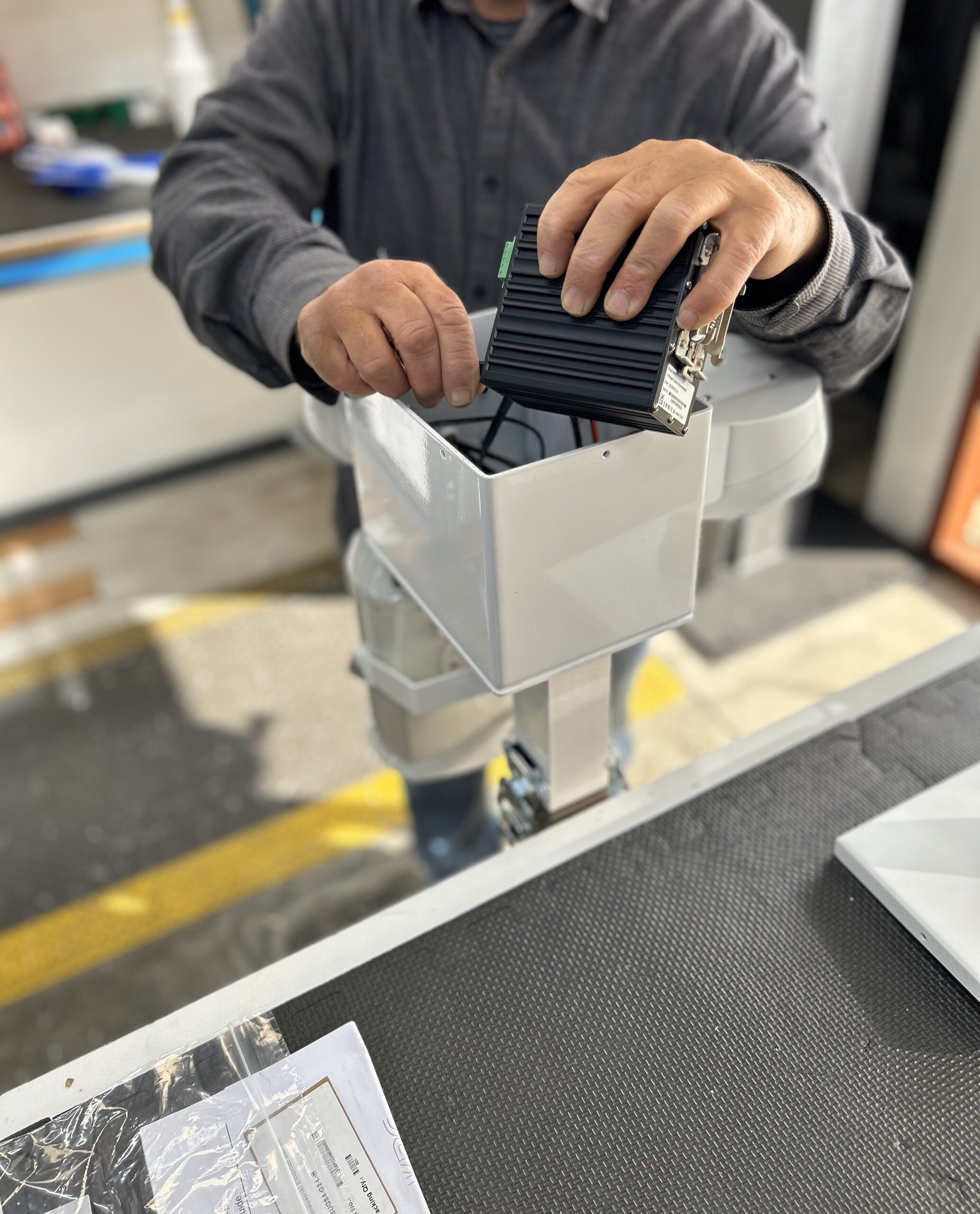 A worker assembling an Allvuz Mobile Surveillance System.